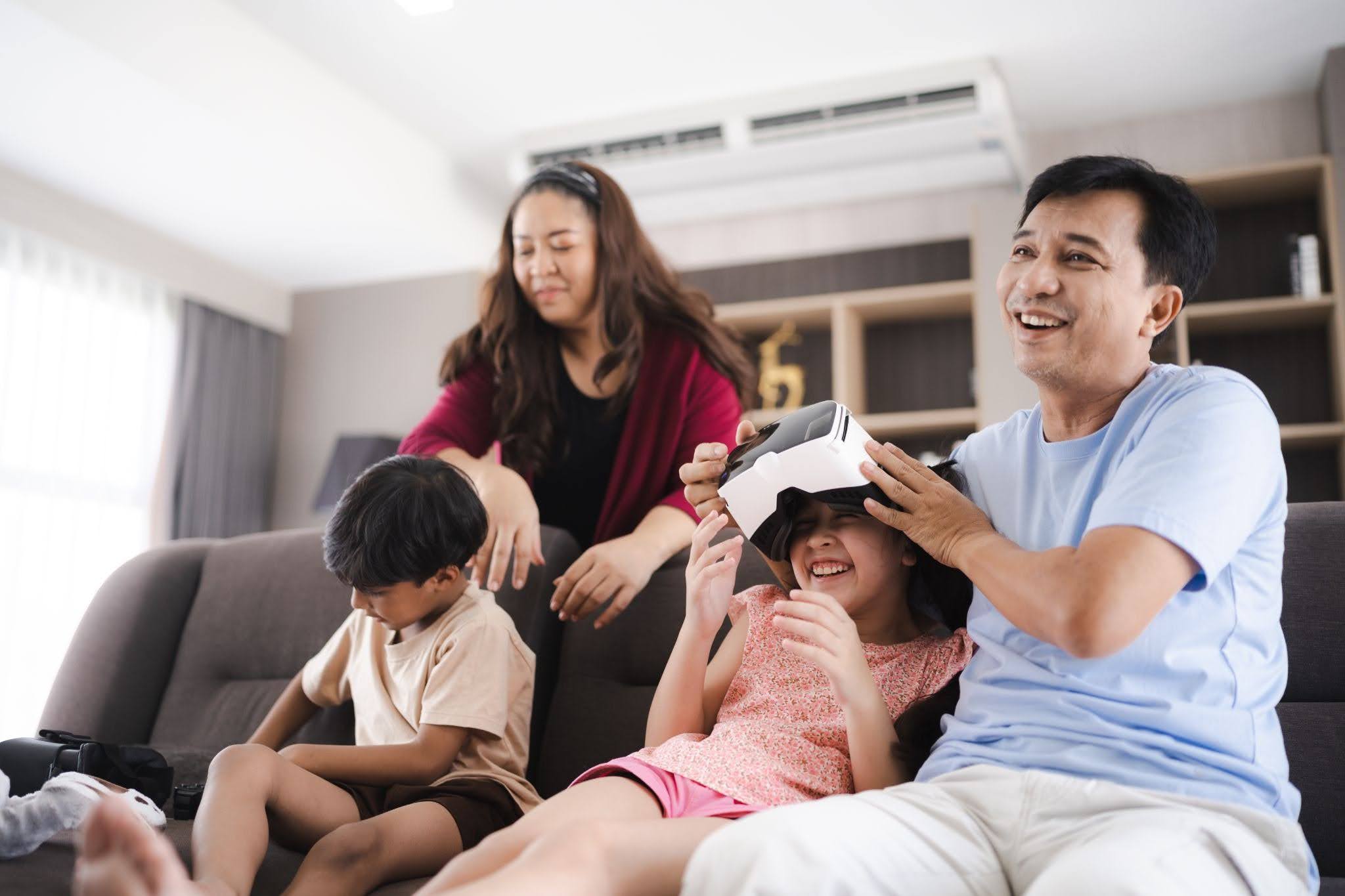 A family relaxing together on the sofa, enjoying free time at home